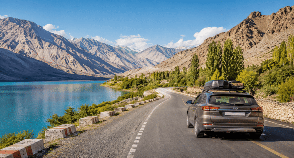 Road trip vehicle on an organized self-drive expedition traveling through a scenic mountain landscape.